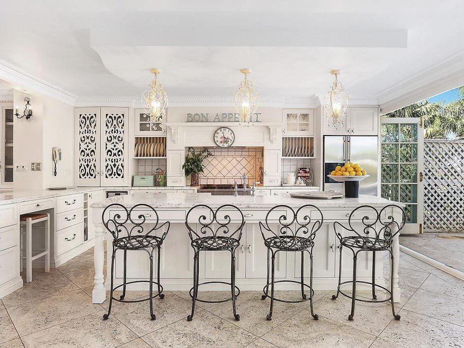 Kitchen island with wrought-iron stools